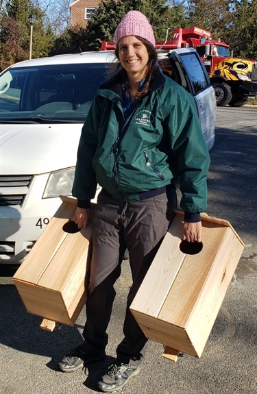 County Staff Jennifer Soles with new wood duck boxes for Sparrow Pond