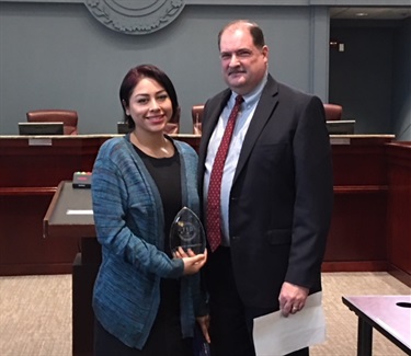 Photo with Emergency Communications Technician April Olivera and ECC Administrator David Mulholland