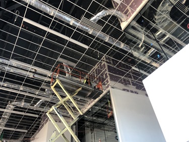 Duct work, Lighting and ceiling grid system installation in the lobby.