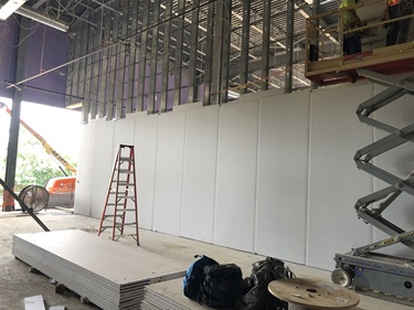 Drywall installation in the Group Exercise room.