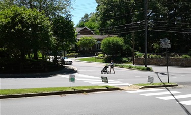 Mid-block crosswalk at Military Road and Gulf Branch trail.