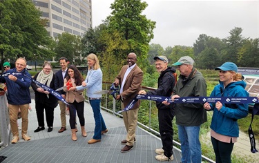 County Board Chair Christian Dorsey celebrates the ribbon cutting at Ballston Wetland Park