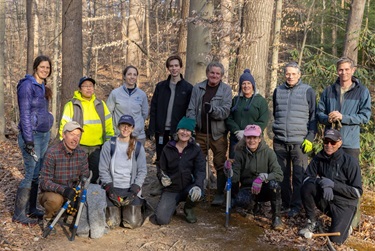 Group photo, 13 volunteers and County staff