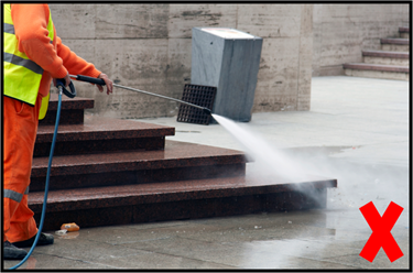 Pressure washing near dumpster