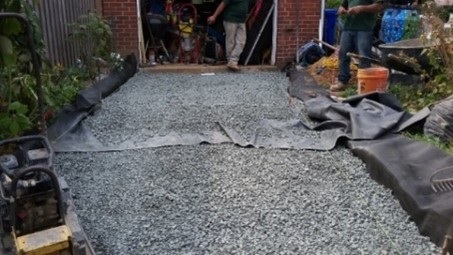 Permeable pavers being laid into driveway.