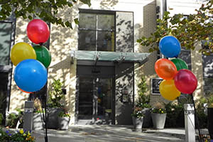 Building entrance with balloons either side the door