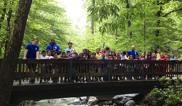 Row of people on bridge