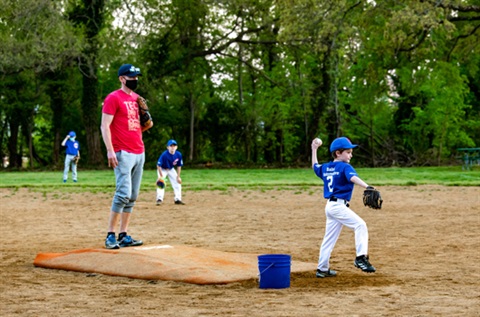 Coach-And-Child-Playing-Baseball.jpg