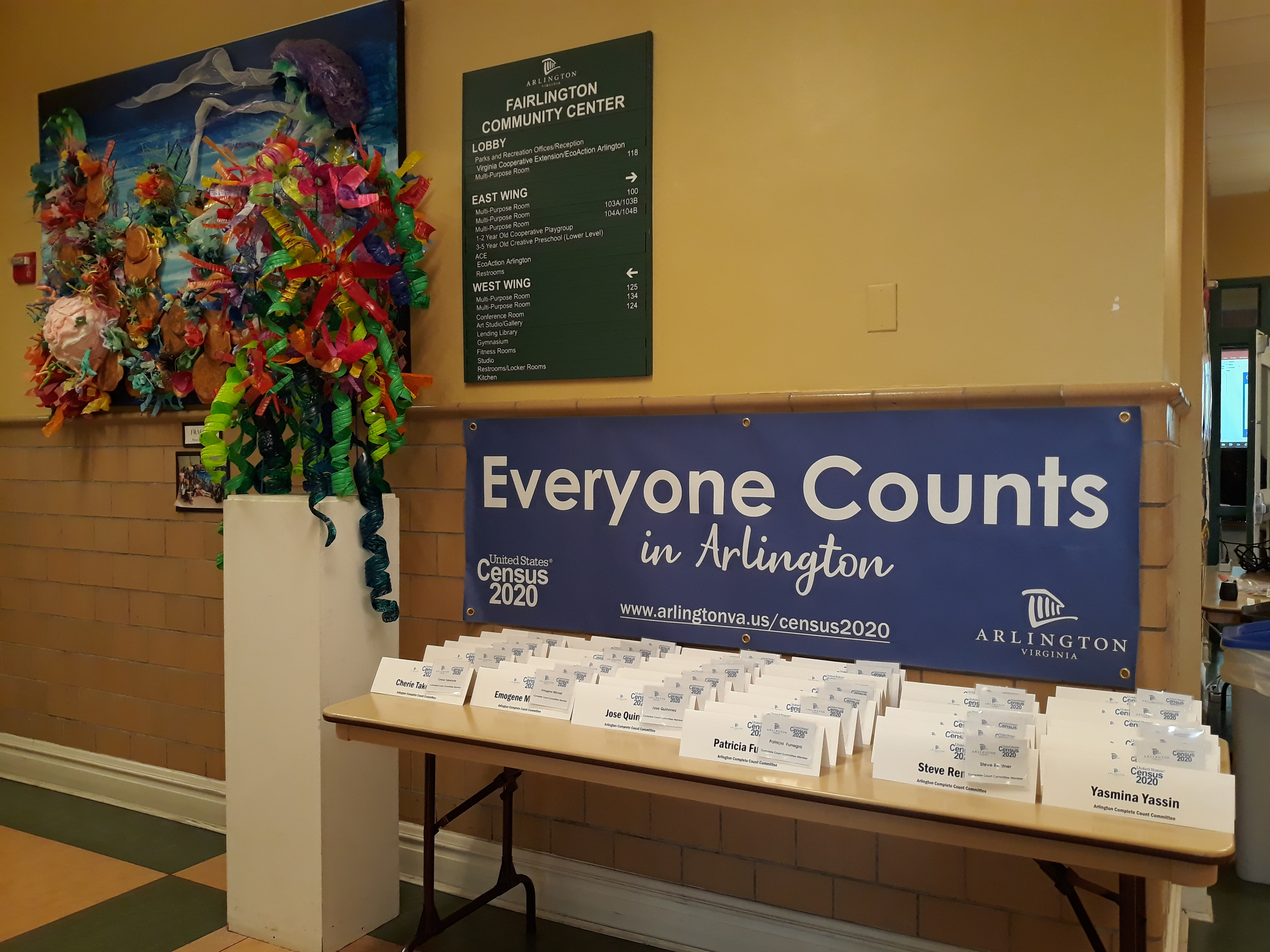 Table with name tags and sign stating Everyone Counts in Arlington