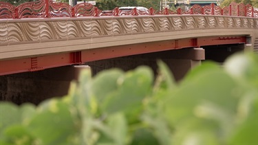 The reconstructed bridge features unique side arcs and patterns, inspired by the natural surroundings, as designed by artist Vicki Scuri.